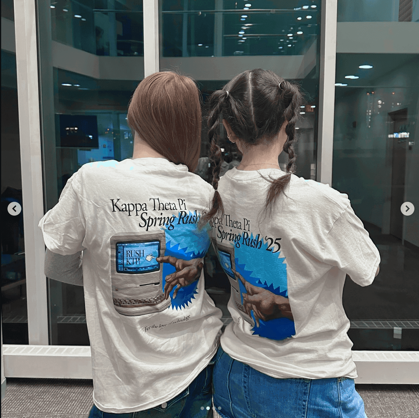 Kappa Theta Pi members wearing merch